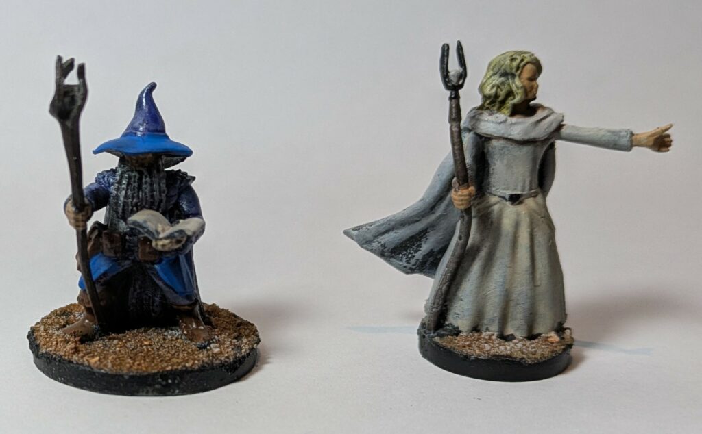 A blue dwarf wizard and a white sorceress
