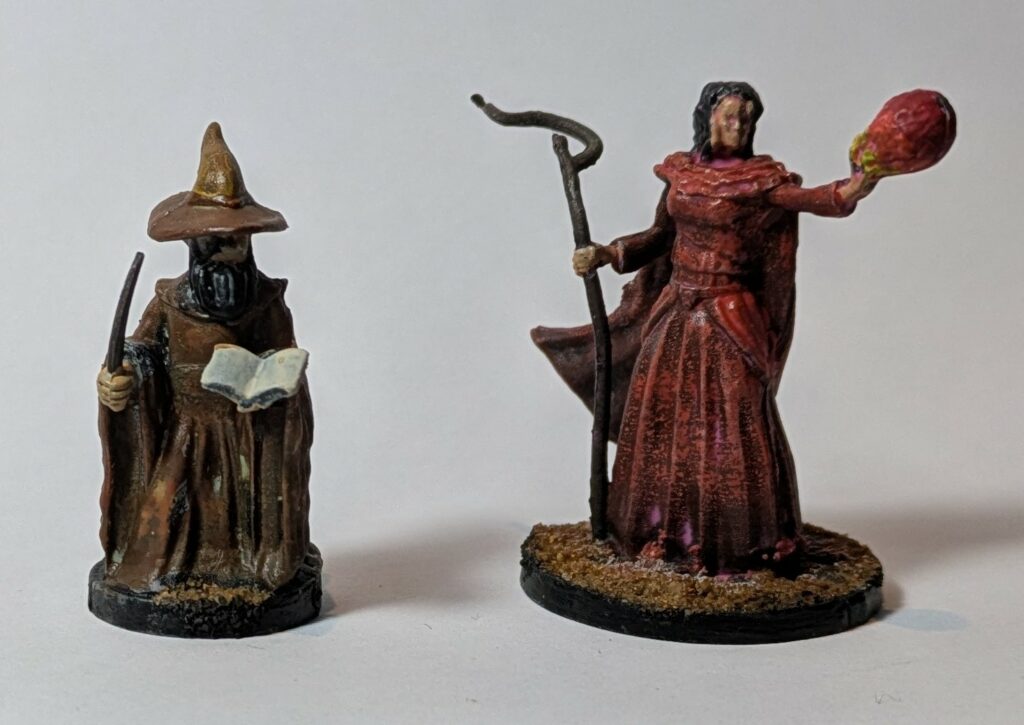 A brown sage and a red wizard