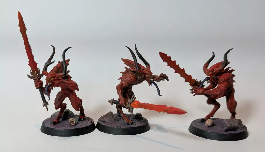 Three Warhammer 40K Chaos Daemons, Bloodletters from Khorne.