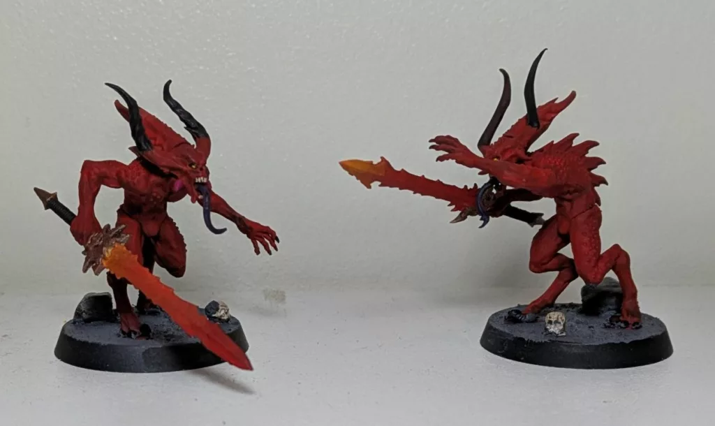Two Warhammer 40K Khorne Chaos Daemons Bloodletters with fiery swords