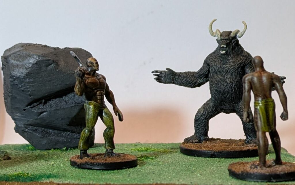 Two buffed warriors are facing a Rajang