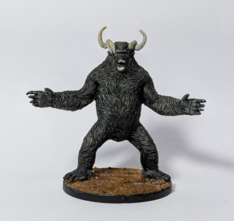 A big black and grey gorilla daemon looking like a Rajang