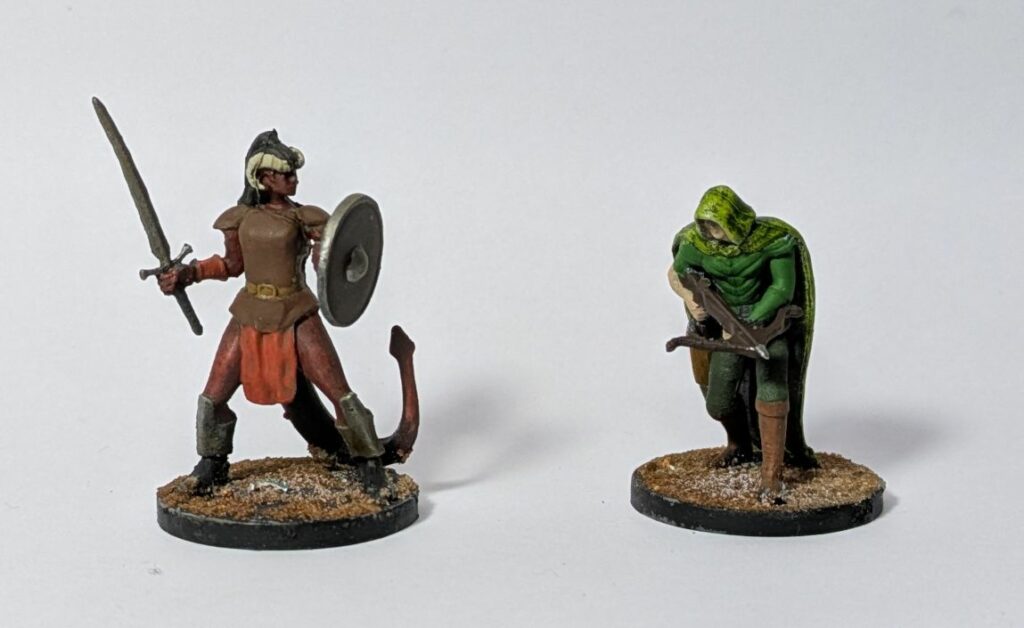 A tieffelin with a sword and a shield, and a humain with a crossbow.