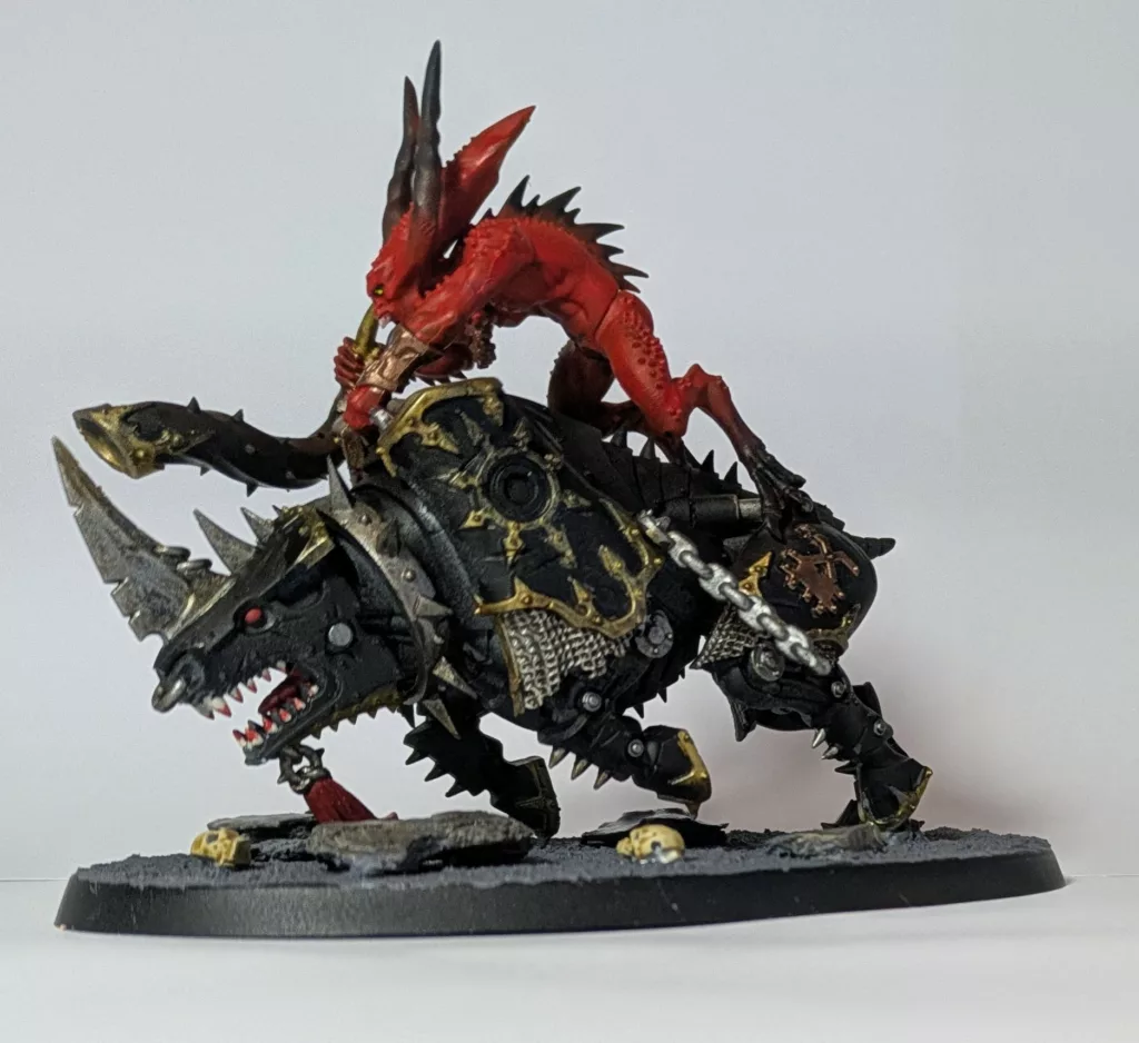 Warhammer 40K Chaos Daemons Bloodcrushers holding a horn.