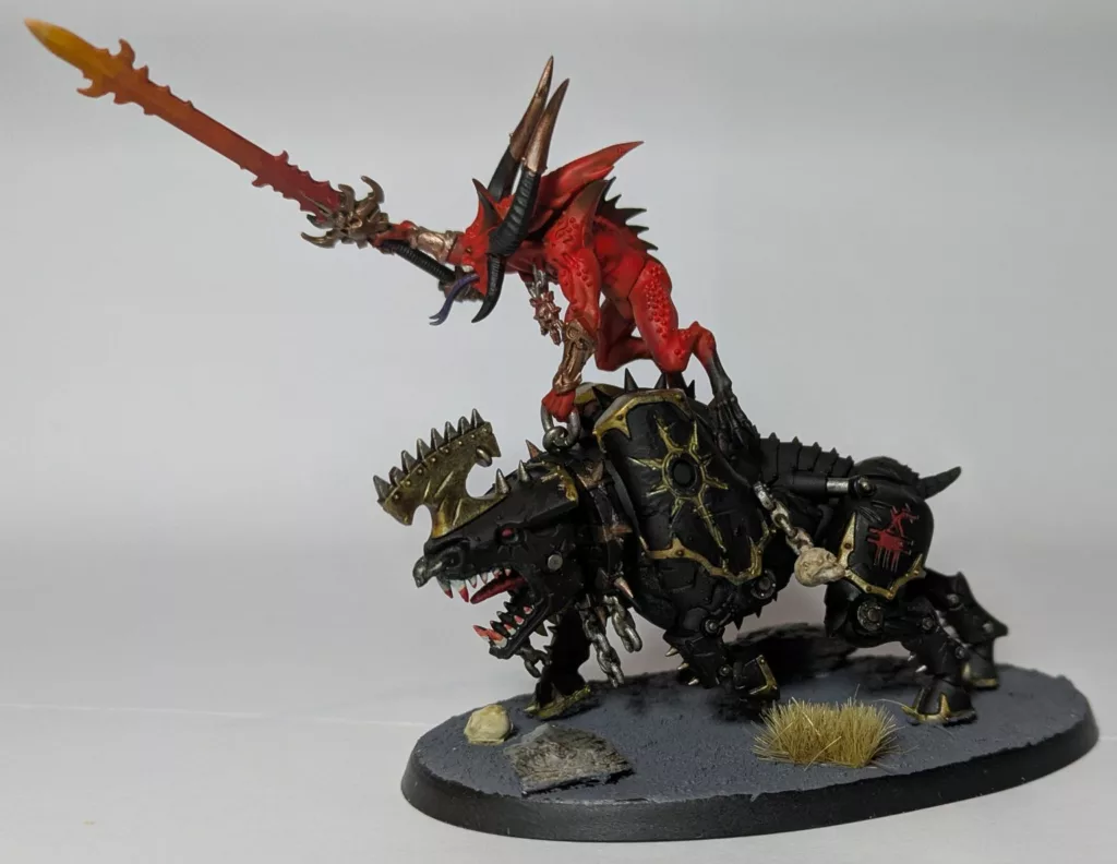 Warhammer 40K Chaos Daemons Bloodcrushers holding a fiery sword.